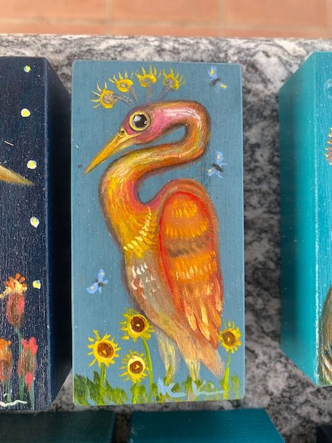 Glücksvogel Pfau Orange und Sonnenblumen März 2026